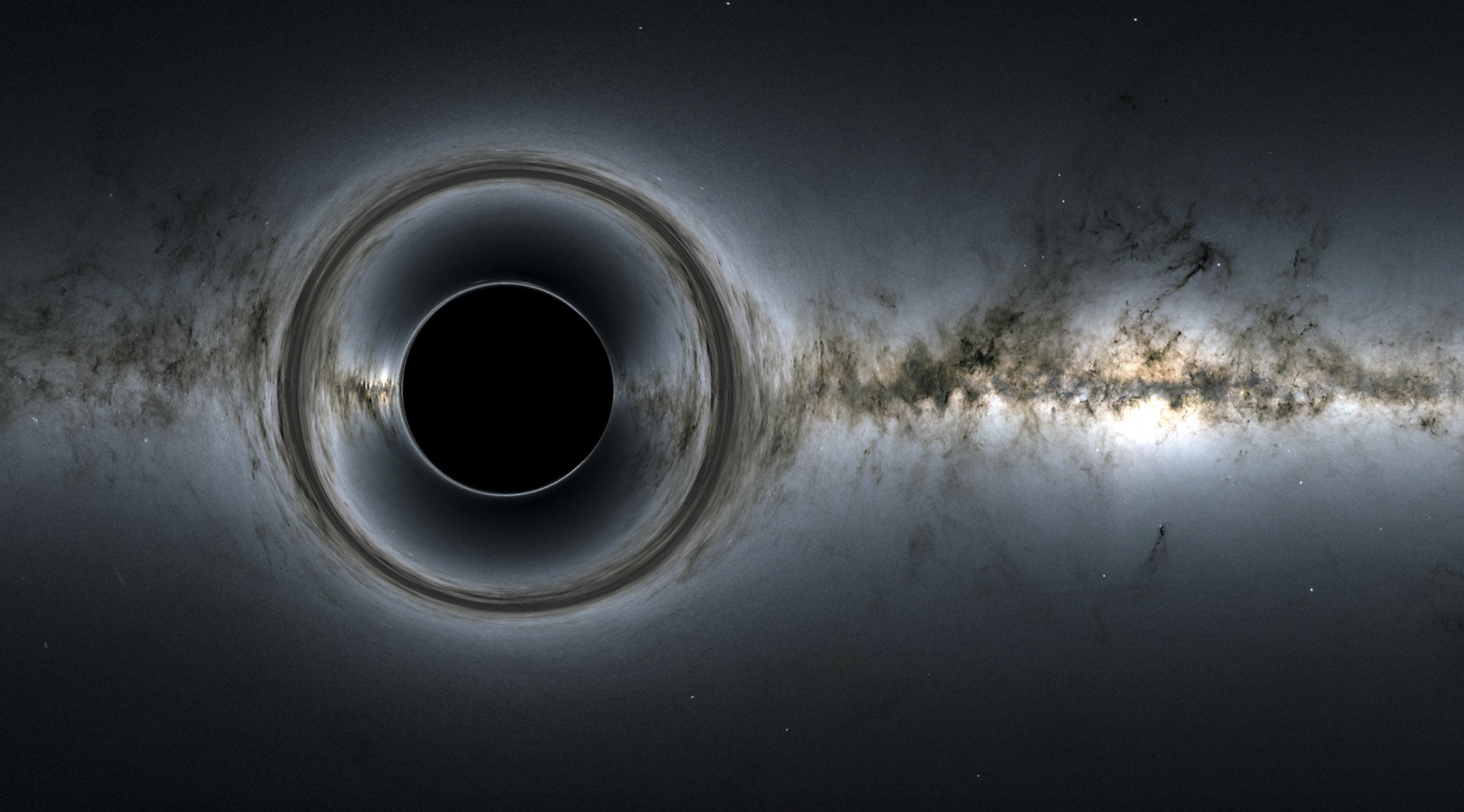 Esta imagen de un agujero negro supermasivo muestra cómo distorsiona la región estelar y captura la luz, creando la silueta de un agujero negro.